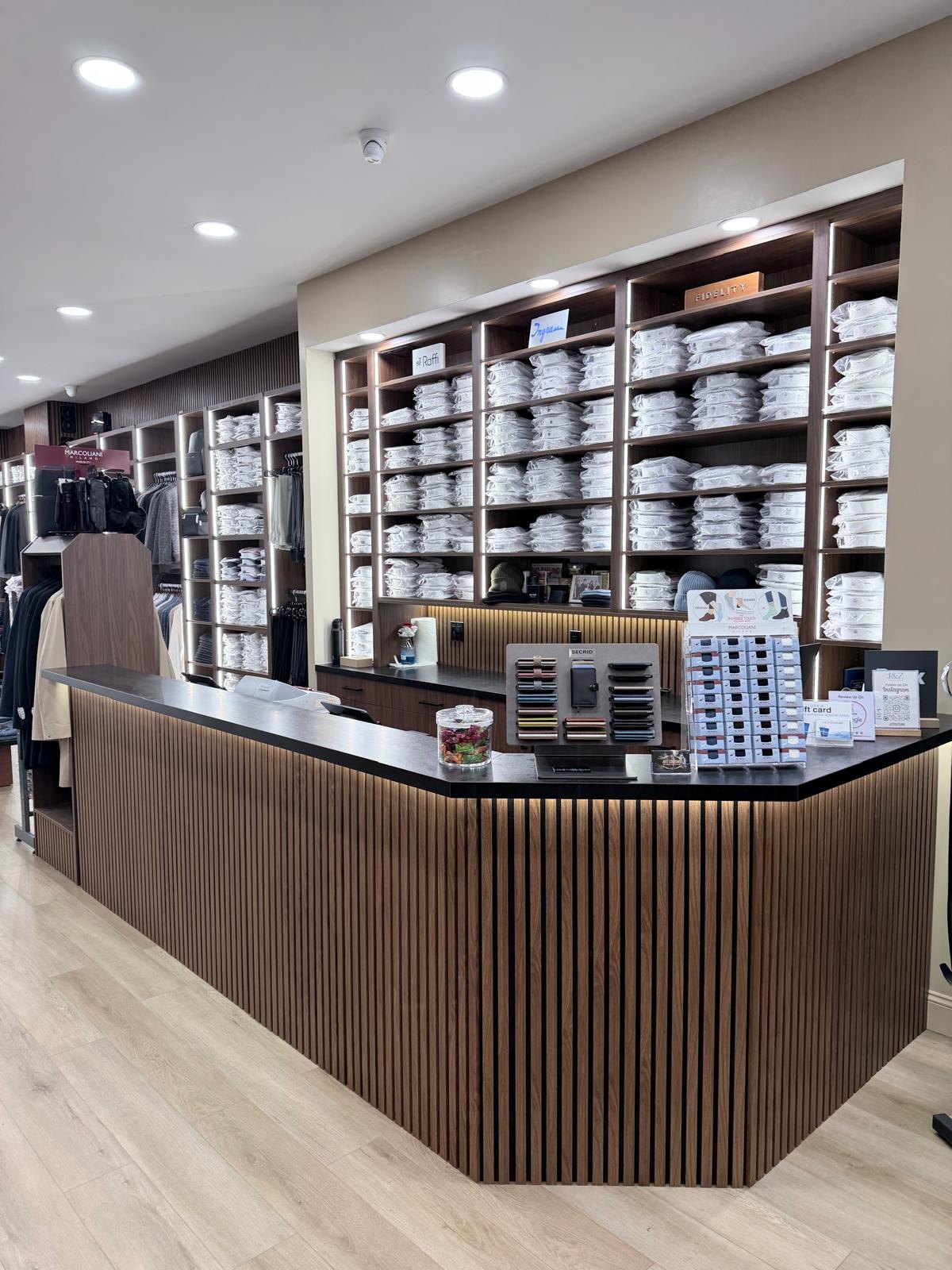 Dress shirts behind the counter